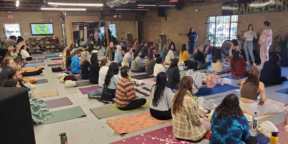 Sold-out wellness workshop at Space512 with dozens of guests seated on mats